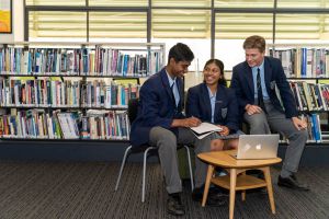 All Saints Catholic College Student Voice - students in discussion at the library