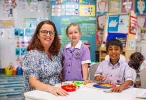 Kindergarten students work with their teacher at St Joseph's Catholic Primary School Rosebery.