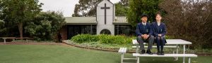 two students from All Saints Catholic College in the playground